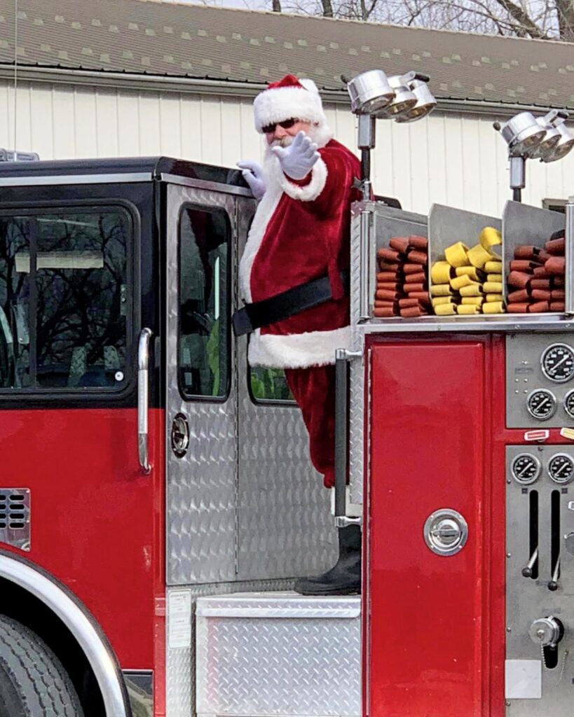 Santa Tom waving to the crowd at a Central Missouri parade